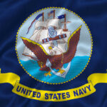 United States Navy flag with eagle and ship.