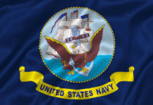 United States Navy flag with eagle and ship.