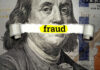 Dollar bill with fraud text overlay