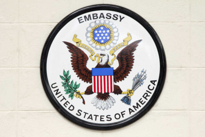 Seal of the United States Embassy featuring an eagle and national colors