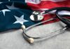 A stethoscope resting on an American flag