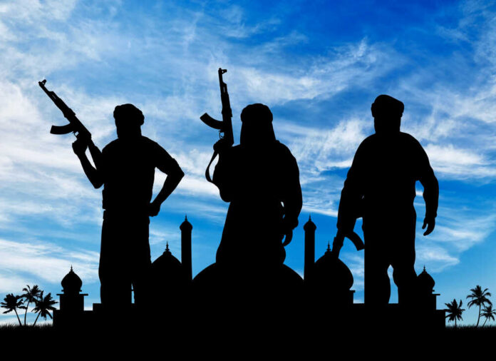 shutterstock_357863918 (1).jpg Silhouetted figures holding weapons against a blue sky
