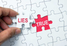 A hand holding a puzzle piece labeled 'LIES' next to a piece labeled 'TRUE'