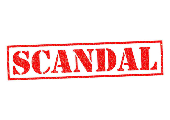 shutterstock_224824333-1 Red stamp with the word scandal