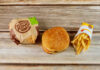 Burger King hamburger and fries on a wooden surface