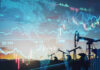 Oil pumps and financial charts against world map