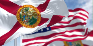 Florida state flags waving in the wind.