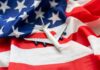 A model airplane placed on an American flag