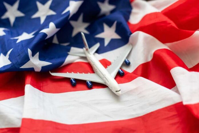 A model airplane placed on an American flag