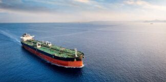 An oil tanker navigating through calm ocean waters