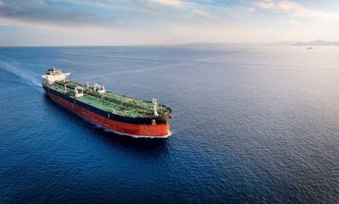 Aerial,View,Of,A,Large,Crude,Oil,Tanker,Traveling,Over An oil tanker navigating through calm ocean waters