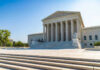 United States Supreme Court building exterior, sunny day.
