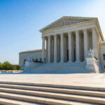United States Supreme Court building exterior, sunny day.
