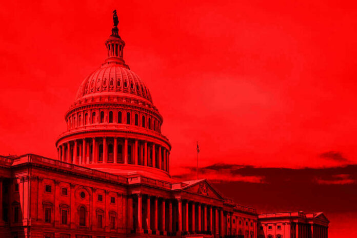 shutterstock_1142146865 United States Capitol building under red-tinted sky.