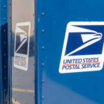 Row of blue United States Postal Service mailboxes