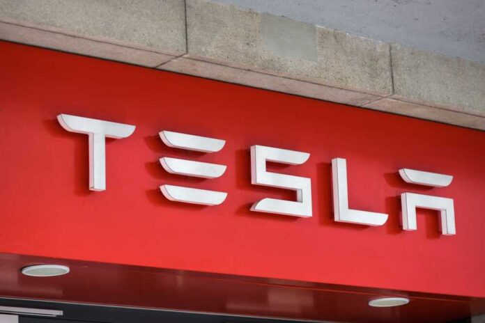 Zurich,,Zurich,switzerland,-,06,11,2022:,A,Sign,Of,A Tesla logo displayed on a red background