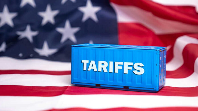 shutterstock_2593025849 Shipping container reading tariffs on the American flag