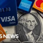 Record number of Americans carrying credit card debt they can't pay off, report shows