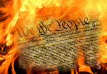 Burning U.S. Constitution amidst flames.
