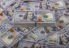 Stack of one hundred dollar bills, Benjamin Franklins portrait.