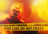 Firefighter emergency light with fire line tape