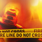 Firefighter emergency light with fire line tape