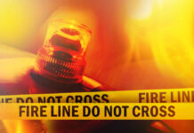 Firefighter emergency light with fire line tape