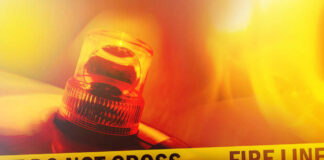 Firefighter emergency light with fire line tape