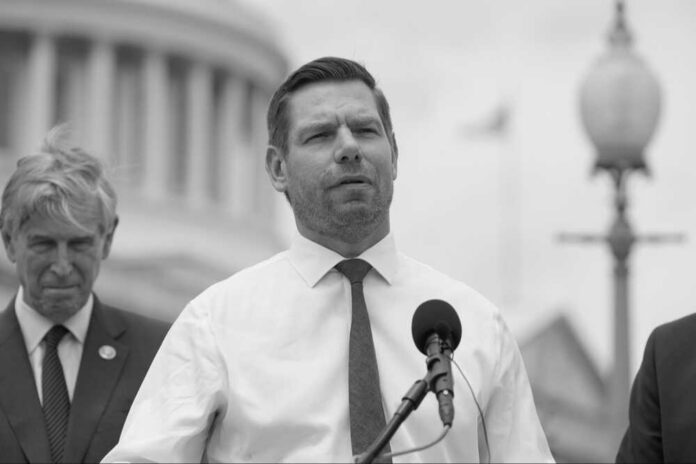 Eric Swalwell in a podium speaking