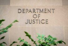 Department of Justice building wall with engraved lettering