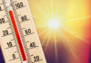 Thermometer shows high temperature under scorching sun.