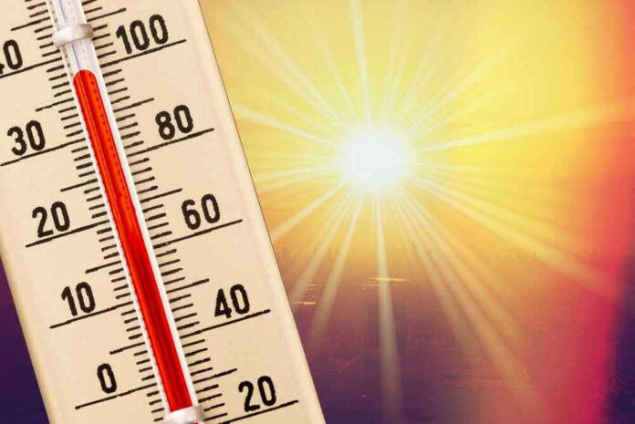 Thermometer shows high temperature under scorching sun.