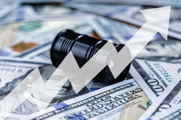 A,Black,Barrel,Of,Oil,On,Dollar,Bills,And,Arrow An oil barrel placed on a background of dollar bills with an upward trend graph overlay