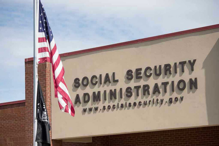 1332438944 Social Security Administration building with American flag outside.