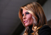 Melania Trump in a close-up side profile speaking