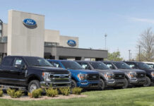 Ford dealership with trucks lined up outside