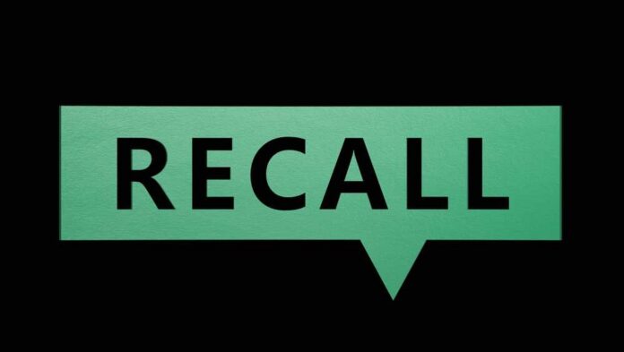 Green speech bubble with the word recall on a black background