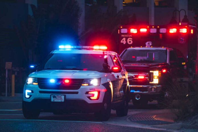 shutterstock2002708079jpg Police car and ambulance with flashing lights nighttime