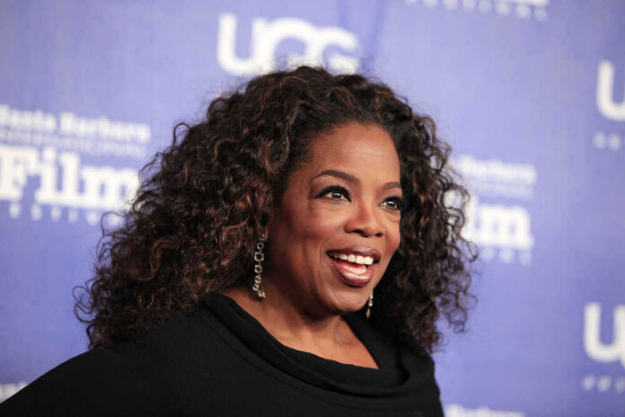 shutterstock_175331414 Oprah Winfrey smiles.