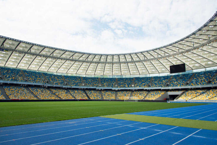 Kiev,,Ukraine,-,May,17,,2019,-,Panoramic,View,Of Empty stadium with blue running track and green field