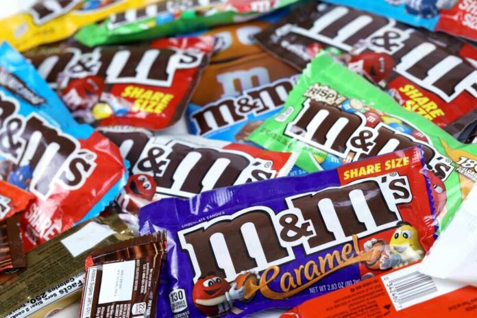 M&M's candy bags in assorted flavors spread out