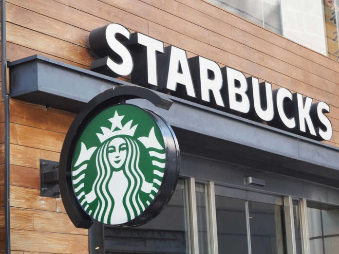 shutterstock_2424822809 Starbucks cafe exterior with logo and sign