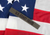 U.S. Coast Guard patch on American flag.