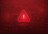 Warning triangle icon on red digital background